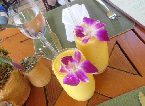 Mango Pineapple Smoothie with edible orchid