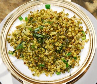 sprouted mung dal over rice garnish cilantro green onion