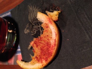 Orange with chili, dried worm